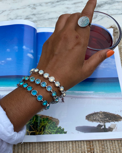 Woman wearing ocean inspired bracelets