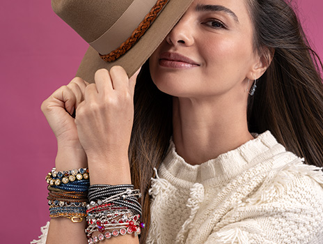 Woman wearing bracelets in fall colors