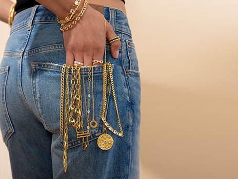 Model dripping in Gold Jewelry