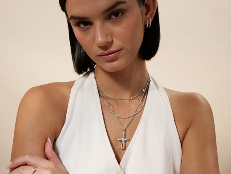 Woman wearing Ribbon Cross necklace