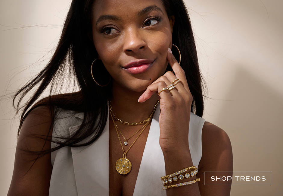 Woman wearing gold layered jewelry