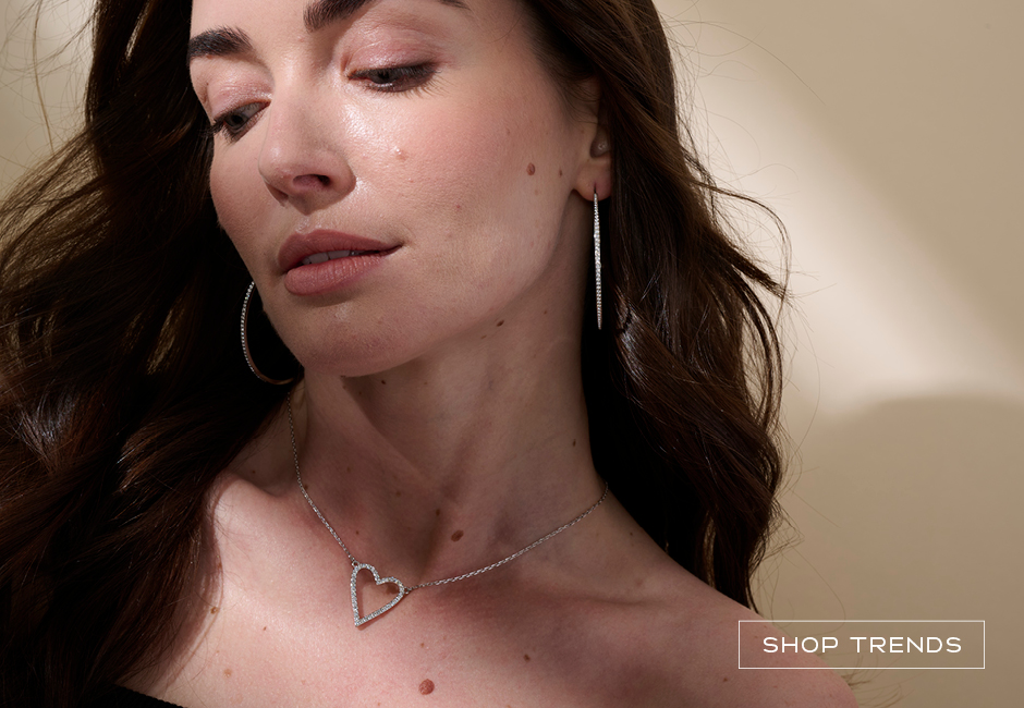 Woman wearing open heart necklace