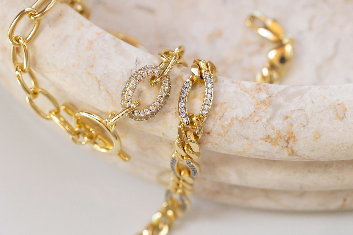 Woman wearing layered golden necklaces