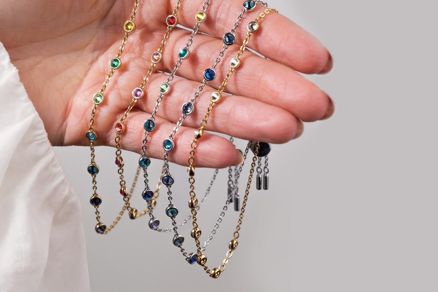 Woman wearing layered golden necklaces