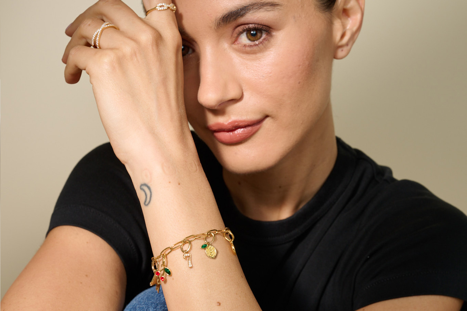 Woman wearing layered golden necklaces
