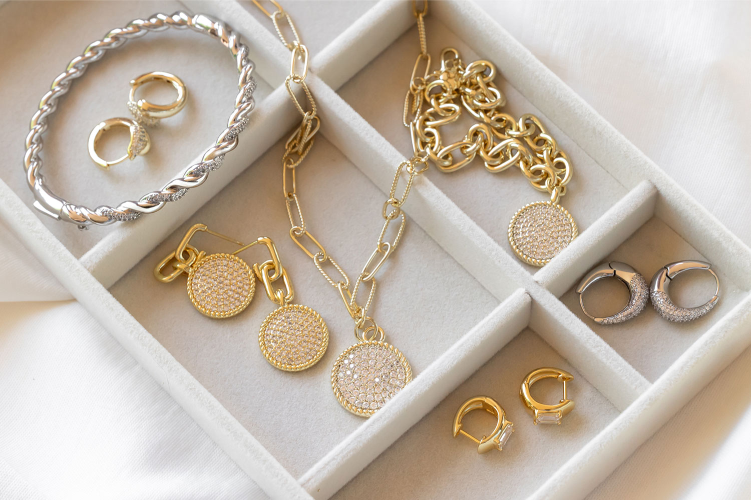 Woman wearing layered golden necklaces